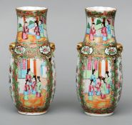 A pair of late 19th century Canton vases The crimpled flared neck rim above twin gilt decorated mask