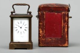 A 19th century brass cased miniature carriage clock The white enamelled dial with Roman numerals and