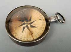 A George III silver compass, hallmarked London 1808 The interior with an inscribed paper dial. 5 cms