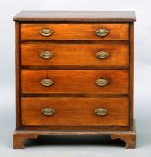 A mahogany chest of drawers, of small proportions The rectangular top above four drawers with