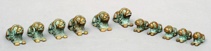 A set of six bronze weights Modelled as lions; together with five similar, but smaller, all with