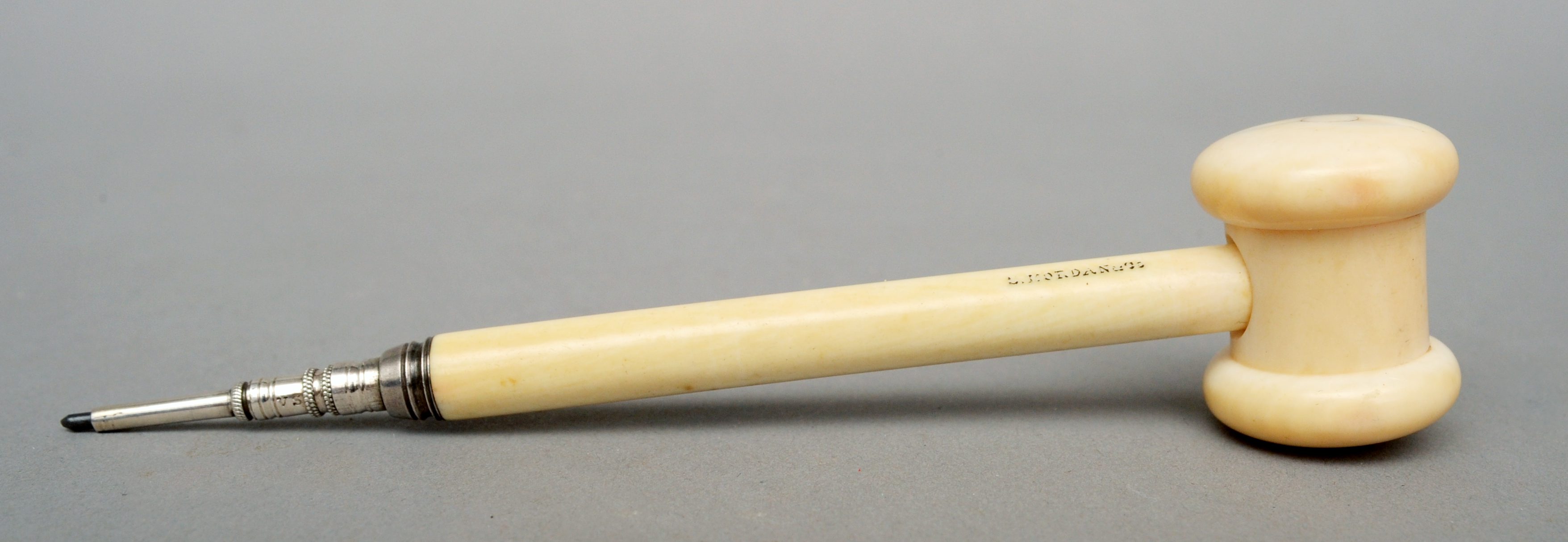 A Victorian Sampson & Morden ivory propelling pencil Formed as a gavel, the shaft inscribed S Morden