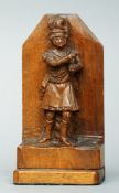 A 19th century carved walnut bookend Modelled with the figure of a Highlander in uniform. 19.5 cms