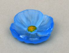 A Daum glass paperweight Formed as a blue flower with yellow centre, the base inscribed Daum,