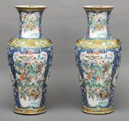 A pair of late 19th/early 20th century Chinese porcelain vases Each decorated with waring figures