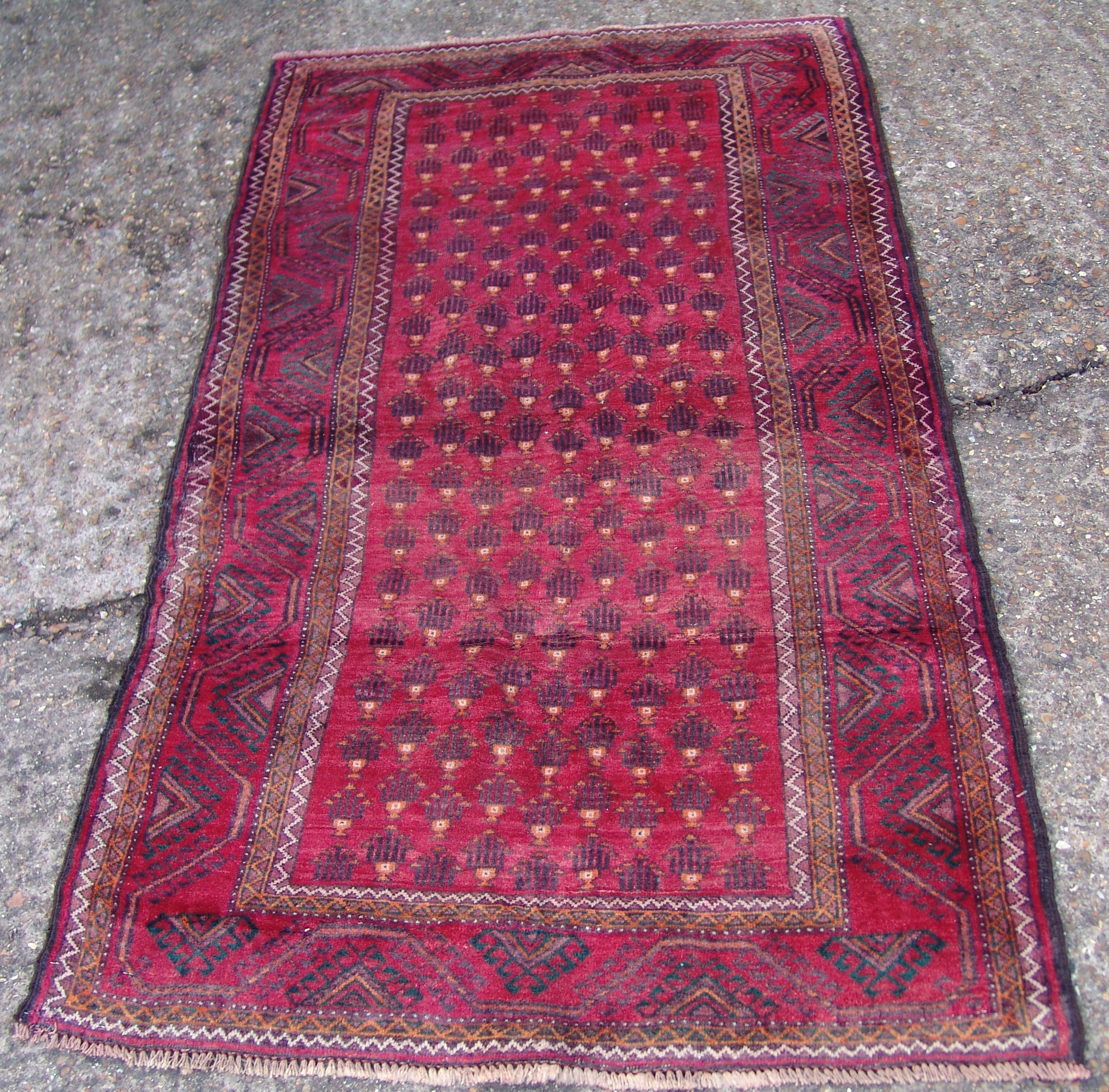 A Buluch wool rug 195 x 110 cms.