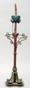 A decorative Arts & Crafts style table lamp The top with fittings for two light bulbs above a