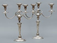 A pair of 19th century Old Sheffield plate twin branch candelabra Of Neo-Classical form; together