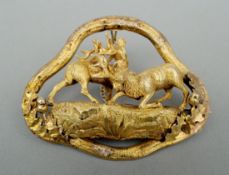 A Victorian unmarked yellow metal brooch Formed as a pair of rutting stags flanked by oak leaves and