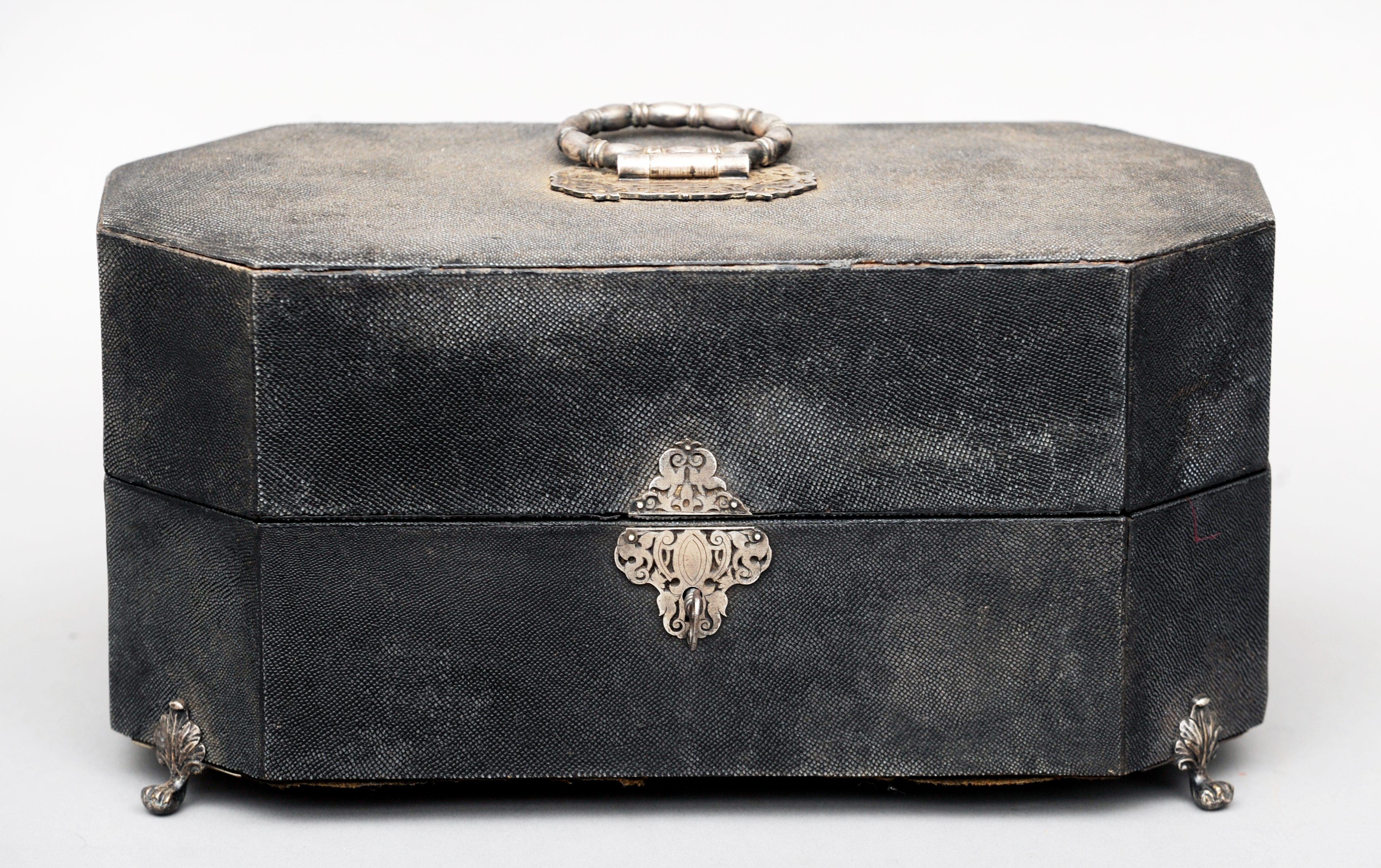 A 19th century white metal mounted tea caddy The exterior covered with shagreen, standing on four