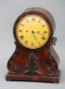 A Regency mahogany bracket clock The balloon shaped case with carved acanthus detail, the painted