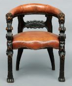 A 19th century leather upholstered carved oak tub chair The leather padded back rail above a