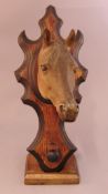 An Edwardian hunting bridle holder Mounted with a painted papier mache horse’s head. 34.5 cms high