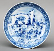 A Chinese blue and white charger The rim decorated with a band of bats amongst clouds, the centre