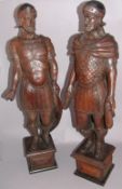 A pair of 19th century carved oak newel postsModelled as Roman soldiers, standing on plinth bases.