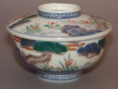 A Chinese porcelain rice bowl and cover Decorated with various birds in a continuous river