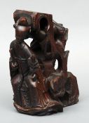 Three 18th/19th century Chinese wood carvings One a sage, another of a deity dancing atop a toad,