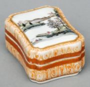 A Chinese porcelain ink box and cover The lid decorated with figures in a lakeland landscape, the