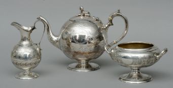 A Victorian Scottish silver three piece tea set, hallmarked Edinburgh 1879, maker’s mark of J & NC