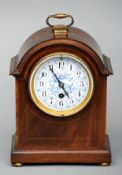 An Edwardian mahogany mantel clock The crossbanded and line inlaid case fitted with a French