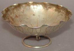 A late 19th/early 20th century Chinese white metal bowl, hallmarked for Wang Hing & Co., Hong Kong