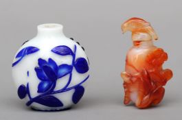 A Chinese cameo glass snuff bottle The white ground with blue floral decoration; together with