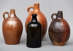 Three 19th century stoneware bellamines Each of typical form with loop handles. The largest 31 cms