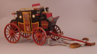 A Scratch Built model of a Victorian stage coach Decorated in black and burgundy livery and