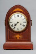 A late 19th/early 20th century simulated inlaid mahogany lancet cased mantle clock The silvered dial