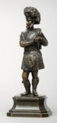 A 19th century bronze model of a Highland Solider Modelled standing in regimental uniform, on a