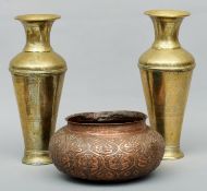 A pair of South East Asian brass vases With engraved decoration; and an unusual copper bowl. The