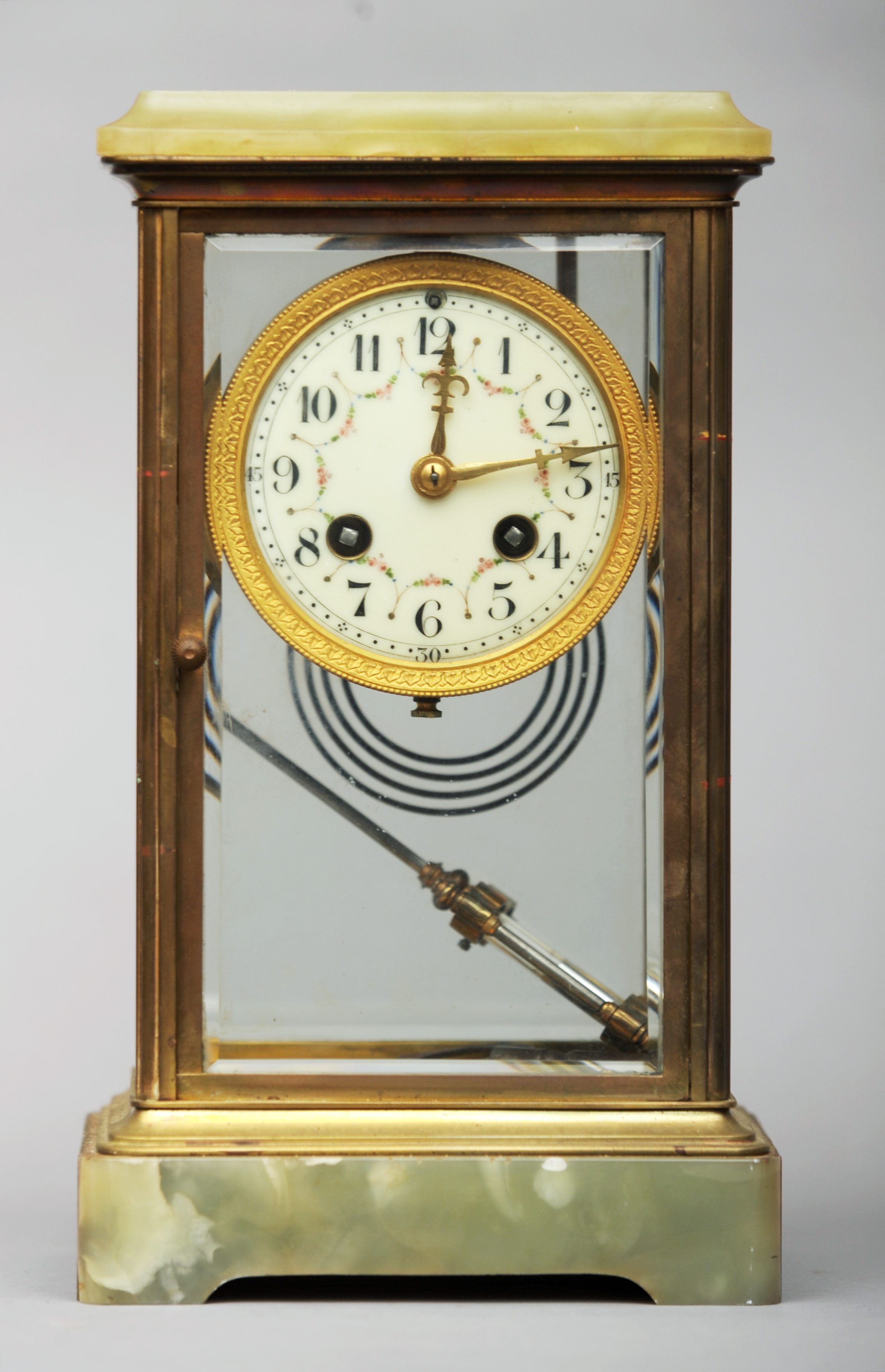 An early 20th century onyx mounted four glass mantel clock The painted enamelled dial with Arabic