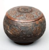 A Chinese coconut box and cover With bands of carved decoration. 12 cms diameter.Split to side, some