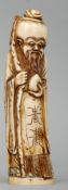 A carved ivory figure of Shao Loa Typically modelled holding a staff with a gourd. 20 cms high.