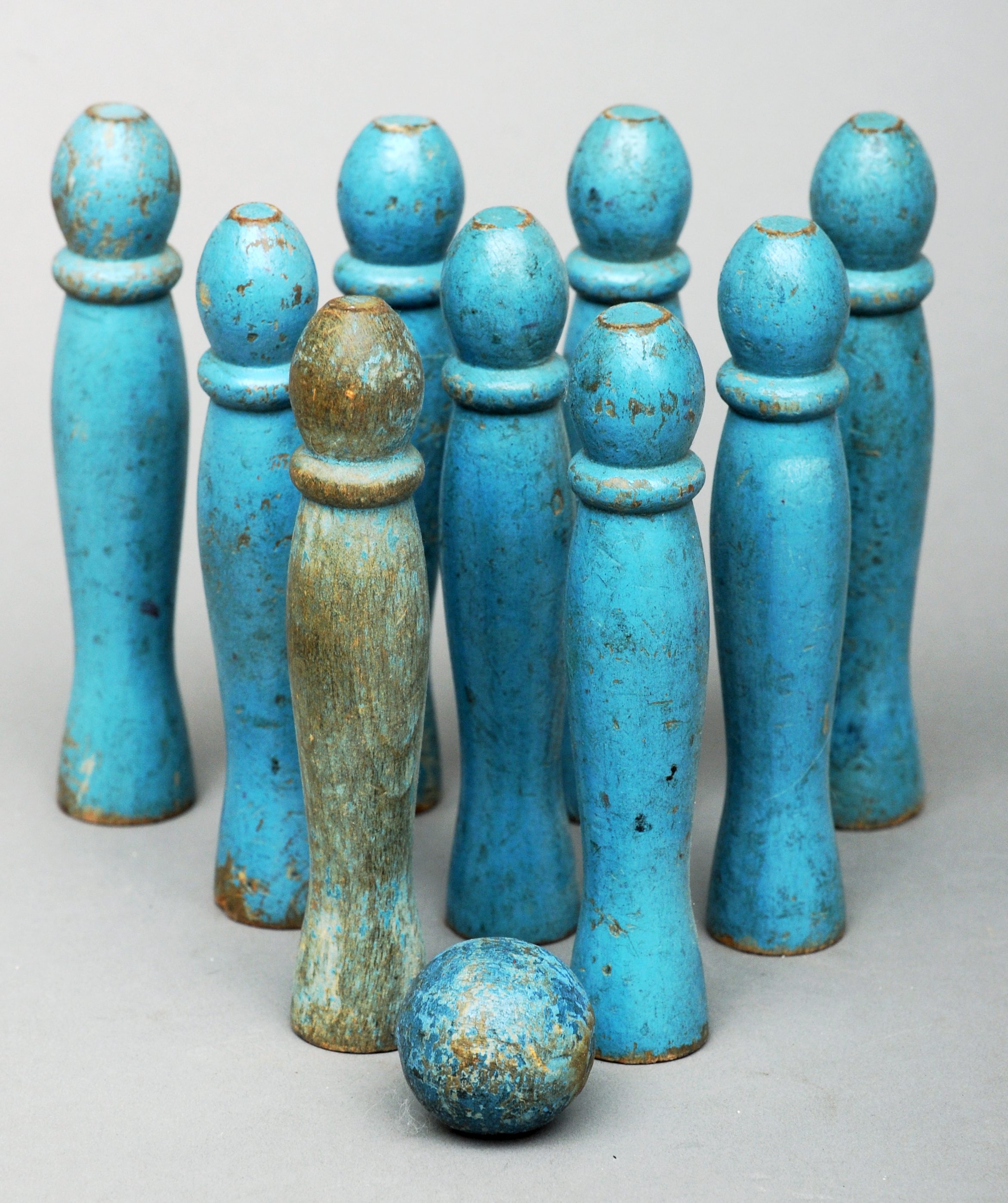 A set of nine Scandinavian late 19th century turned and painted skittles and ball Blue painted,