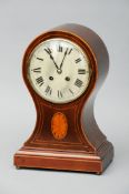 An Edwardian parquetry inlaid mahogany cased balloon mantel clock The white painted dial with