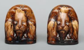 A pair of 19th century Staffordshire treacle glazed pottery sash window jacks Each typically