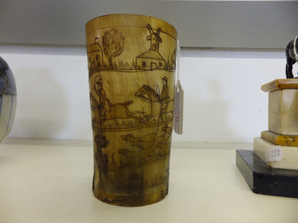 A Victorian carved horn tumbler with hunting scene decoration