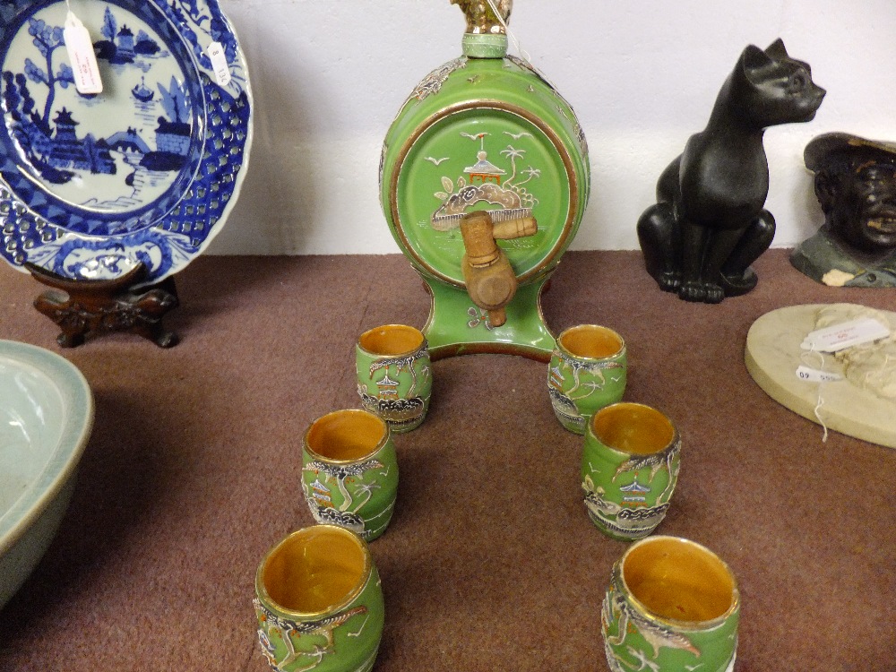 A Japanese hand painted liqueur barrel and six drinking vessels