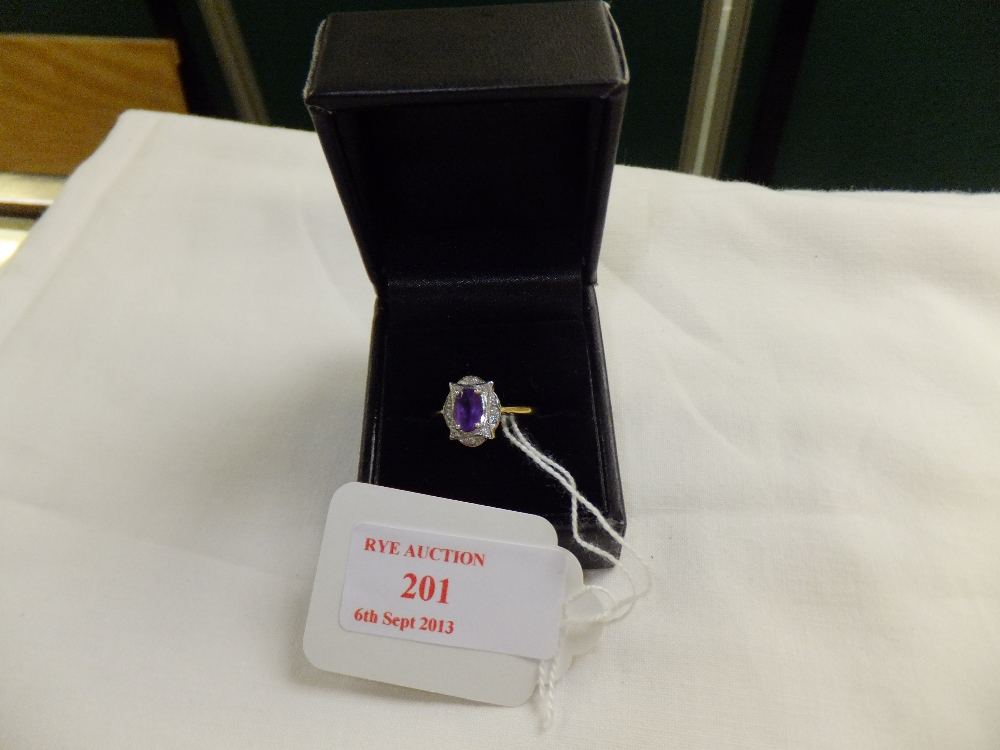 A 9ct gold amethyst and diamond ring, size O