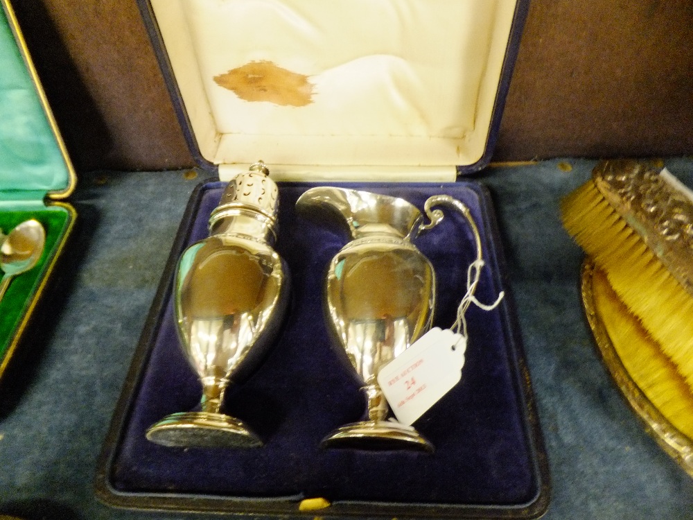 A Birmingham 1925 silver cream jug and sugar caster by Mappin and Webb, boxed