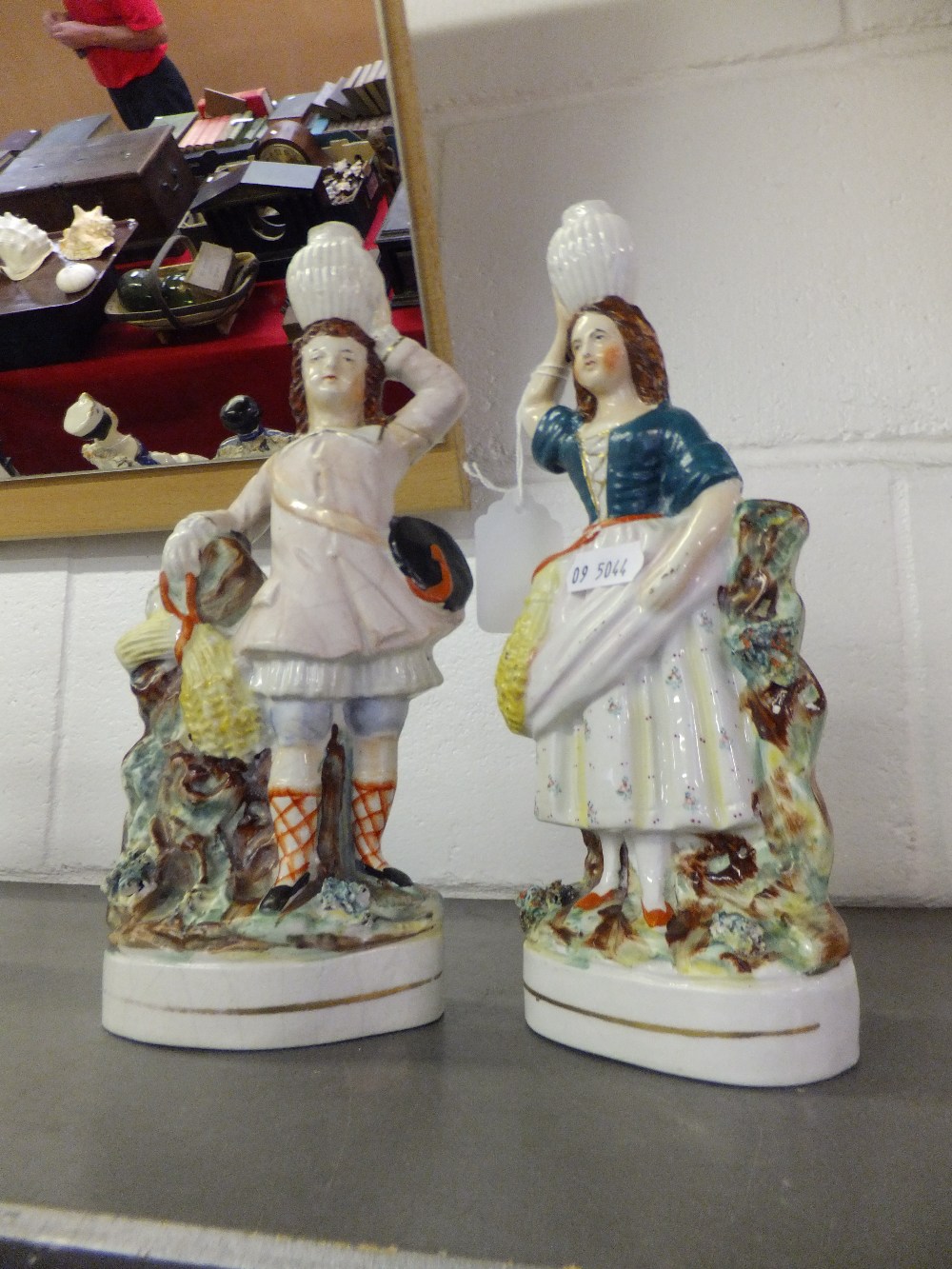 A pair of Staffordshire flatback figures 'Water carriers' A/F