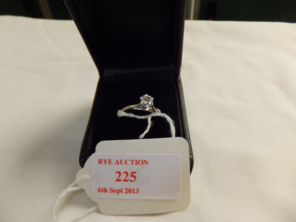 A 9ct white gold solitaire ring, size N