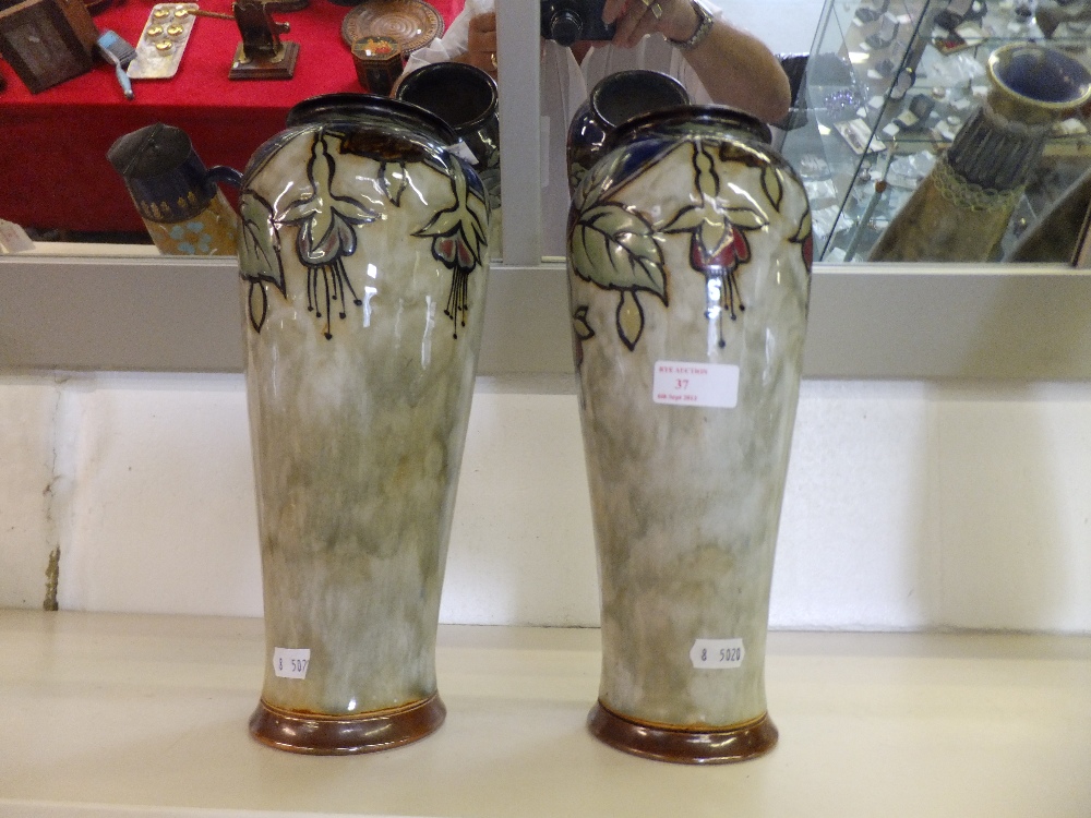 A pair of Royal Doulton stoneware vases of tapering cylindrical form with applied floral