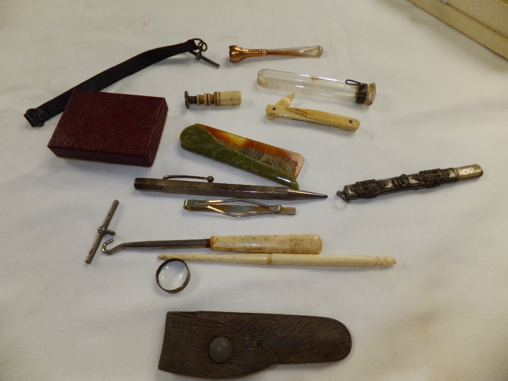 A mixed selection of items to include a 9ct gold and mother of pearl cheroot holder, a vintage