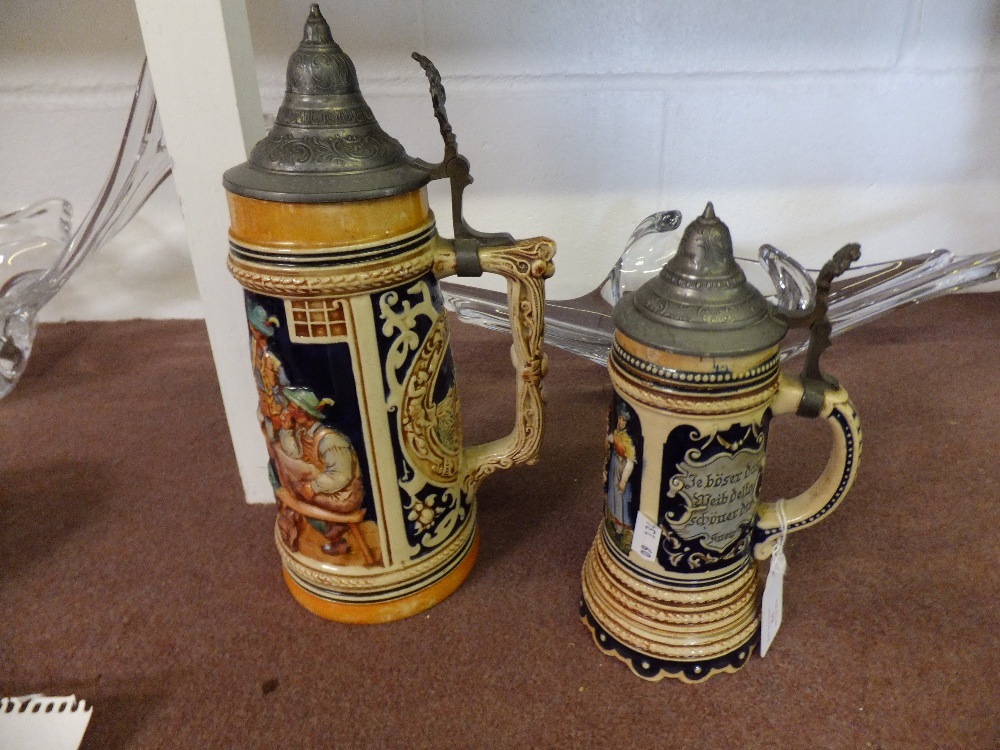 Two vintage beer steins with embossed decoration