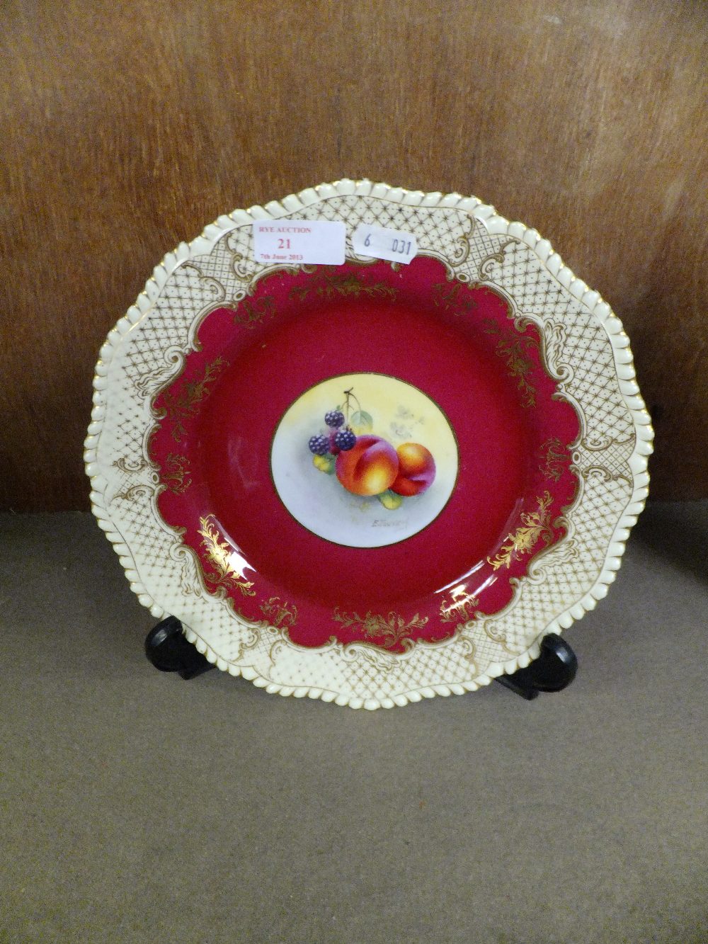 A Royal Worcester plate with fruit decorated panel signed E. Townsend