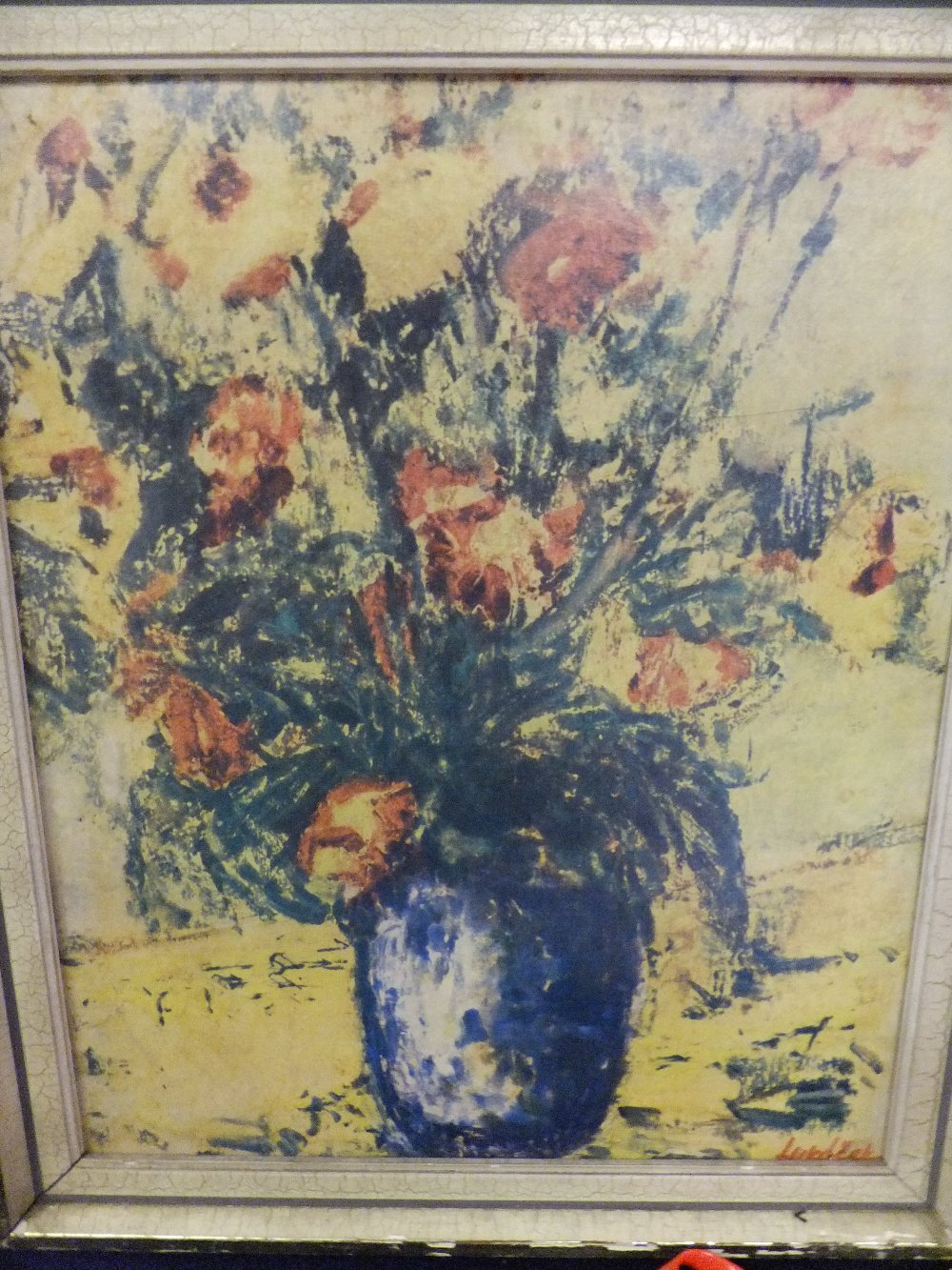 A vintage print of a still life study of flowers, framed