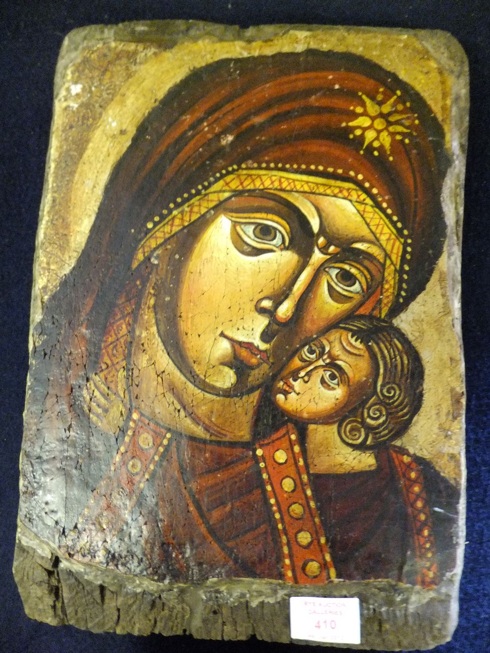 A 20thC religious icon of Mary and Christ in the Byzantine style, mounted on wood base