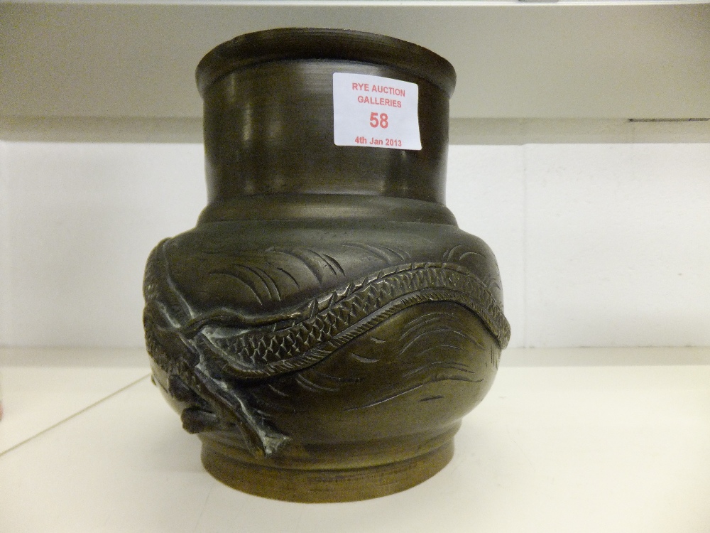 A bronze vase with applied dragon decoration